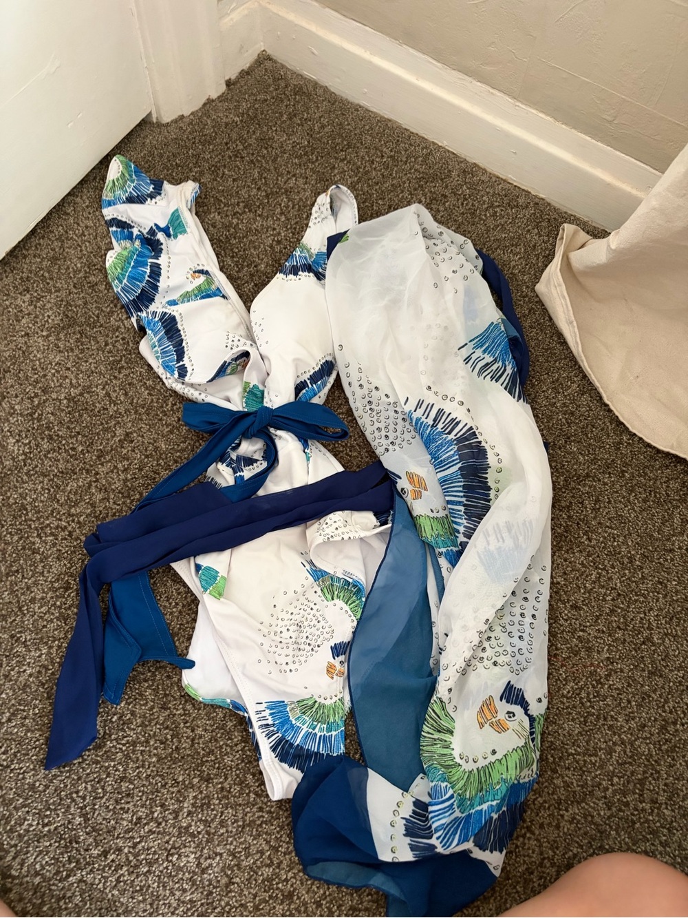 White One-Piece Swimsuit with Blue & Green Print and Navy sarong skirt